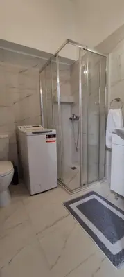 a bathroom with a shower and a toilet at Studio Next to Acropolis in Athens