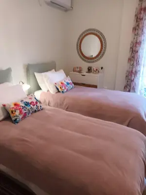 two beds sitting next to each other in a bedroom at Studio Next to Acropolis in Athens