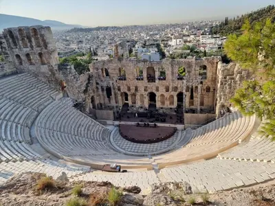 an amphitheater with a city in the background at Studio Next to Acropolis in Athens