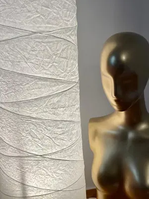 a bronze statue in front of a piece of paper at Kallithea Gold Apartment greendom in Athens