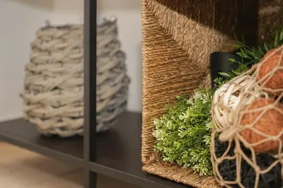 a shelf with a basket and a vase on it at The HostMaster Cosmopolitan Downtown Scent in Athens