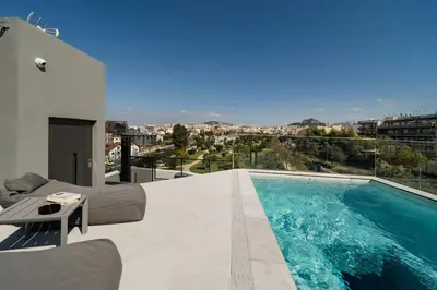 a swimming pool on the roof of a house at The HostMaster Skyline Pool Oasis Penthouse in Athens