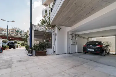 a car is parked inside of a garage at The HostMaster Skyline Pool Oasis Penthouse in Athens