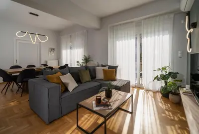 a living room with a couch and a table at Deluxe 4 Bedrooms Apartment in Athens Center in Athens