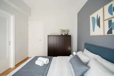 a bedroom with a bed with two towels on it at Deluxe 4 Bedrooms Apartment in Athens Center in Athens