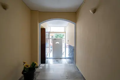 an archway leading to a hallway with a door at Deluxe 4 Bedrooms Apartment in Athens Center in Athens
