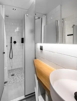 a white bathroom with a sink and a shower at Mosaikon Glostel in Athens