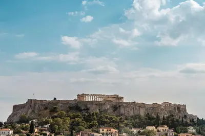a view of the acropolis of athens from atop a mountain at Mosaikon Glostel in Athens