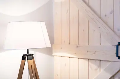a lamp sitting next to a wooden stair case at Modita Boutique Apartments in Athens