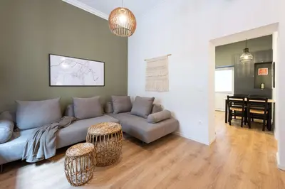 a living room with a couch and a table at Modita Boutique Apartments in Athens