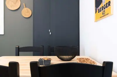 a dining room table with a bowl on top of it at Modita Boutique Apartments in Athens