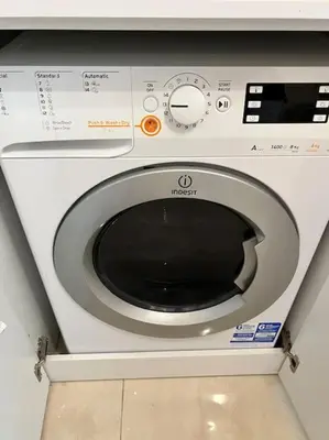 a washing machine sitting in a room at Lux Beach Apartment in Vari