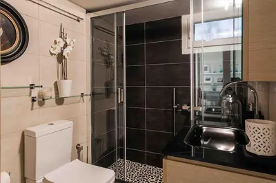 a bathroom with a toilet and a sink at Lux Beach Apartment in Vari