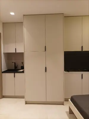 a bedroom with white cabinets and a bed at Evripidou Experience - The smart double C in Athens