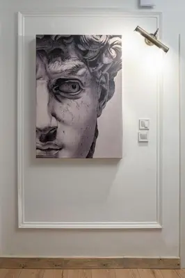 a picture of a bust of a woman on a wall at Athenian Postmodern Gem in Athens