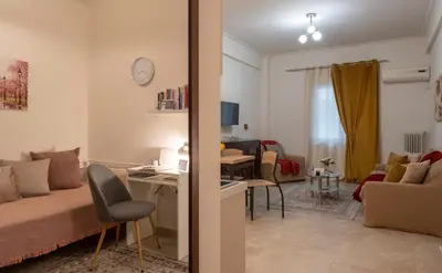 a living room with a couch and a table at Athenian Dream Apartment-Spacious Comfortable & Luxurious in a real Athenian neighborhood in Athens