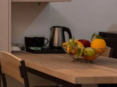 a bowl of fruit sitting on top of a kitchen counter at Athenian Dream Apartment-Spacious Comfortable & Luxurious in a real Athenian neighborhood in Athens