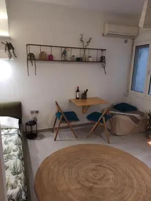 a room with a table and chairs in a room at Mosaics Athens easystay in the Historical centre in Athens