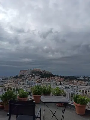 a view of a city from the roof of a building at Mosaics Athens easystay in the Historical centre in Athens
