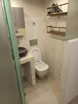 a small bathroom with a toilet and a sink at Mosaics Athens easystay in the Historical centre in Athens
