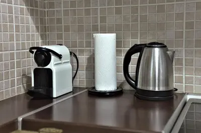 a coffee maker and a toaster on a kitchen counter at Kolonaki Jewel 1st floor feel like home properties in Athens