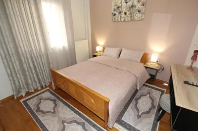 a bedroom with a bed and a window at Bratis House Athens in Athens