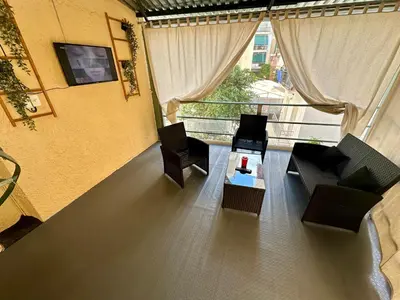 a room with chairs and a table and a window at Bratis House Athens in Athens