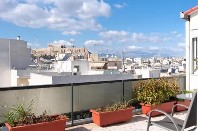 a balcony with a view of a city at Acropolis view Penthouse by WeHost Athens in Athens