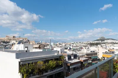 a view of a city from a building at Acropolis view Penthouse by WeHost Athens in Athens