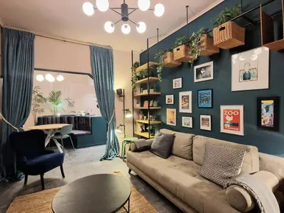 a living room with a couch and a table at Secret Garden Downtown in Athens