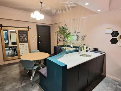 a bathroom with a table and a sink and a table at Secret Garden Downtown in Athens