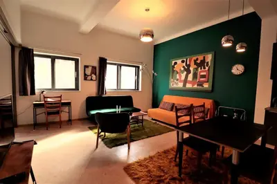 a living room with a couch and a table at Central studio in Monastiraki B in Athens