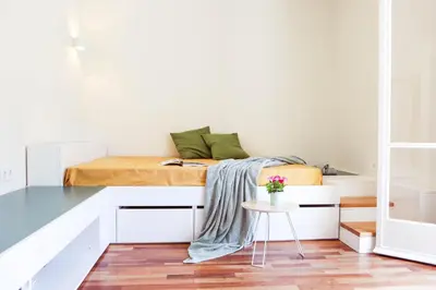 a bedroom with a bed and a table at ViLLaRa: Style, Hospitality & Design (City Center) in Athens