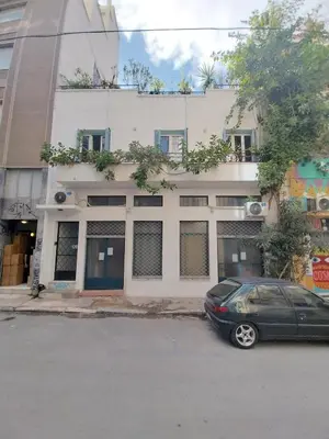 a car parked in front of a building at Architect designed studio with green rooftop! EP7R in Athens