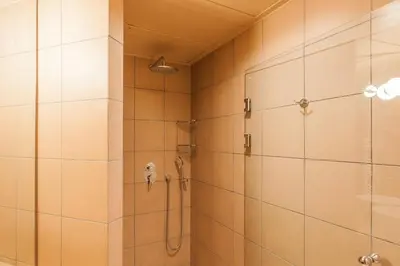 a bathroom with a shower stall and a shower at Architect designed studio with green rooftop! EP7L in Athens