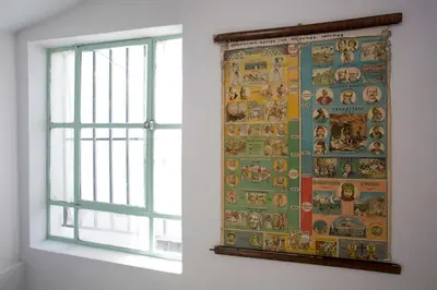 a tapestry hanging on a wall next to a window at Architect designed studio with green rooftop! EP7L in Athens