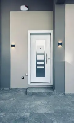 a white door in a room with a tile floor at Hodos Luxury APT near ATH-Airport in Markopoulo