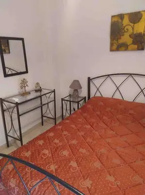 a bedroom with a bed and two side tables at Stella’s cottage in Athens