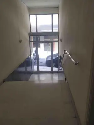 a stairway leading to a door with a car outside at Stella’s cottage in Athens