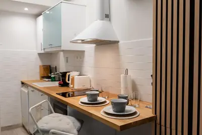 a kitchen with two cups and plates on a counter at Casa Tiffany Acropolis Athens by 3Cs in Athens