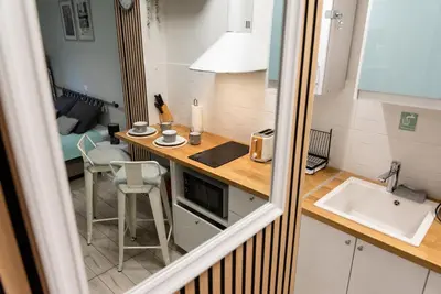 a small kitchen with a counter and a sink at Casa Tiffany Acropolis Athens by 3Cs in Athens