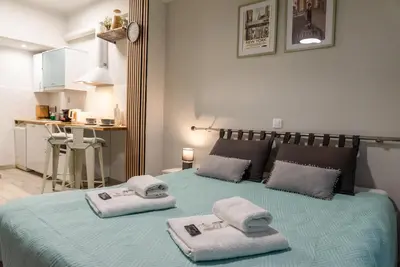 a bedroom with a bed with towels on it at Casa Tiffany Acropolis Athens by 3Cs in Athens