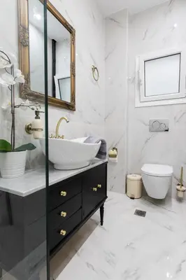a white bathroom with a sink and a toilet at Center of Athens: Iris cozy apartment in Athens