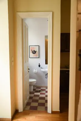 a bathroom with a toilet and a sink at Neoclassical Athens Residence in Athens