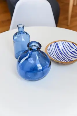 two blue glass vases sitting on top of a table at Neoclassical Athens Residence in Athens