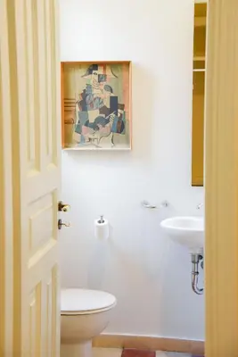 a bathroom with a toilet and a sink at Neoclassical Athens Residence in Athens