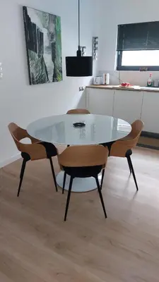 a glass dining table and chairs in a kitchen at Charming Apartment in Chalandri in Athens