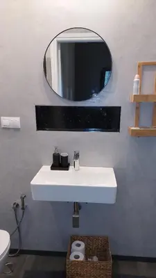 a bathroom with a white sink and a mirror at Charming Apartment in Chalandri in Athens