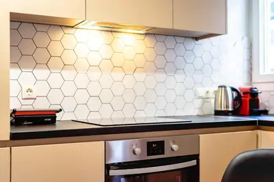a kitchen with a stove and a counter top at Stylish Apartment in Thissio l Dedicated Workspace in Athens