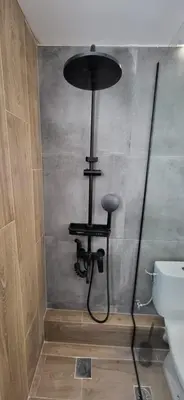 a black light in a bathroom next to a toilet at Luxury Vacation by LV in Athens